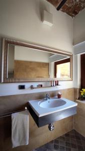 a bathroom with a sink and a large mirror at Sant'Angelo House in Citta' Sant'Angelo +30 photos