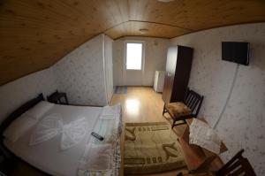 Postel nebo postele na pokoji v ubytování Casa Bucuria Henri Coanda