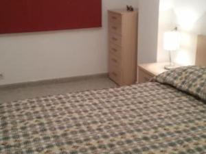 Postelja oz. postelje v sobi nastanitve Apartamento Finisterra
