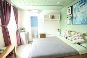 Postel nebo postele na pokoji v ubytování Sleep Box Hostel Phú Quốc