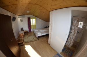 Postel nebo postele na pokoji v ubytování Casa Bucuria Henri Coanda