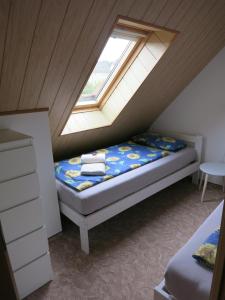 Кровать или кровати в номере Ferienwohnung Schlesinger