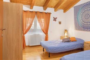Postel nebo postele na pokoji v ubytování Casa Vacanze Il Mandala
