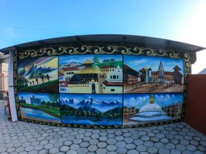 a mural on the side of a building at Greenery View Point Resort in Kathmandu