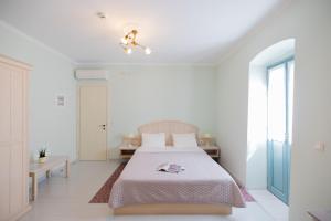 Postel nebo postele na pokoji v ubytování 999 Luxury Hotel