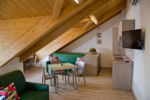 a living room with a table and chairs at Turin Sweet Home in Turin