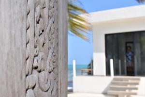 a wooden fence in front of a house at Safira Blu Luxury Resort & Villas in Nungwi