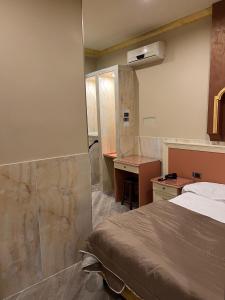 Postel nebo postele na pokoji v ubytování Hotel Iris