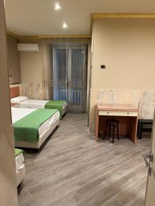 Postel nebo postele na pokoji v ubytování Hotel Iris