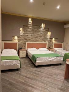 Postel nebo postele na pokoji v ubytování Hotel Iris