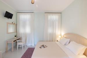 Postel nebo postele na pokoji v ubytování 999 Luxury Hotel