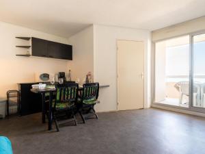 an empty living room with a table and chairs at Apartment Ipanema Sud-6 by Interhome in Canet-en-Roussillon