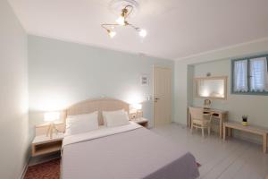 Postel nebo postele na pokoji v ubytování 999 Luxury Hotel