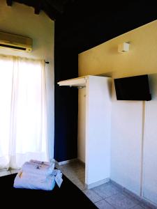 TV a/nebo společenská místnost v ubytování Rigas Rooms