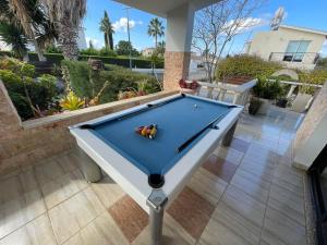 a pool table sitting on top of a patio at Villa Ocean Stones 1Km From Main Coral Bay Beach in Peyia