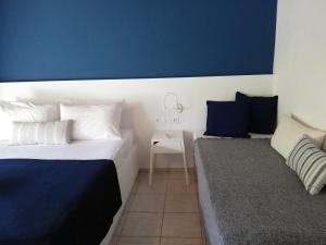 Posteľ alebo postele v izbe v ubytovaní Rigas Rooms