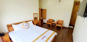 Giường trong phòng chung tại DALAMOON HOTEL
