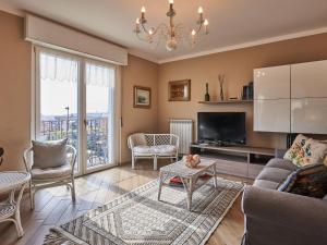 a living room with a couch and a tv at Holiday Home Anna by Interhome in Luino
