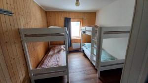 a room with two bunk beds and a window at Tromso Coco Apartments in Center in Tromsø