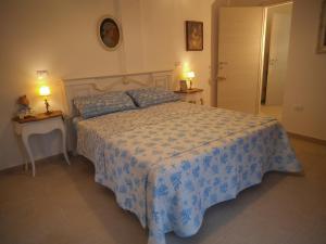 Postel nebo postele na pokoji v ubytování Le Bagnanti Suite