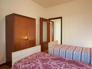 A bed or beds in a room at Apartment Charlie by Interhome