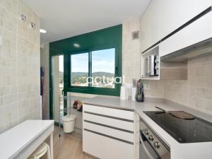 A kitchen or kitchenette at Super Beach 10H