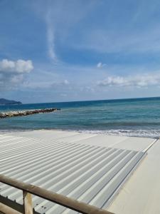 a view of the ocean from the beach at Albergo Stella Di Mare in Lavagna