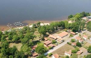an aerial view of a village with trees and houses at Maison charmante à Vielle-Saint-Girons avec vue sur le lac. in Vielle-Saint-Girons