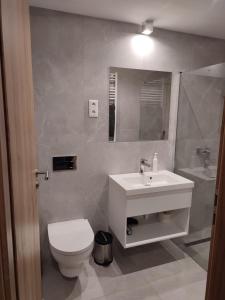 Kúpeľňa v ubytovaní OPÁL Residence Apartman