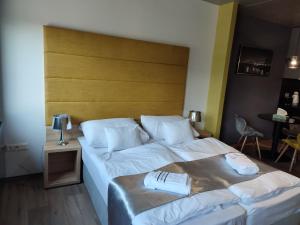 Posteľ alebo postele v izbe v ubytovaní OPÁL Residence Apartman