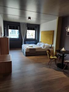 Posteľ alebo postele v izbe v ubytovaní OPÁL Residence Apartman
