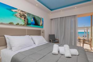 A bed or beds in a room at Sea Diamond Suites