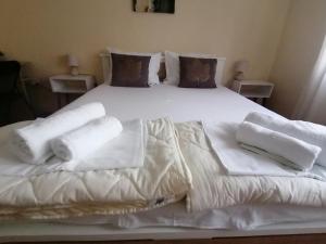 En eller flere senger på et rom på Haus Apartman Zaječar M&L