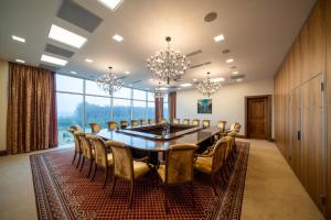 a large conference room with a table and chairs at Harmony Park Hotel & SPA in Prienai