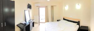 Uma cama ou camas num quarto em Kukësi Resort Aldo
