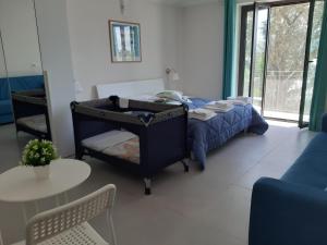 A bed or beds in a room at Un passo dal mare - Guest House