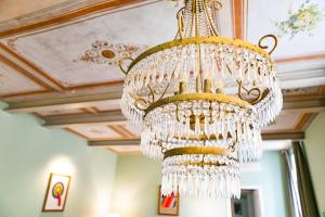a chandelier hanging from a ceiling in a room at Incentrum in Rome