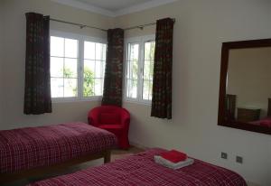 Ένα ή περισσότερα κρεβάτια σε δωμάτιο στο Villa Loretta