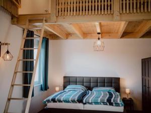 Un pat sau paturi într-o cameră la Rheinzeit-Weisweil