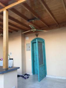 a blue door in a room with a ceiling at j16 in Hurghada