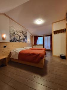 Voodi või voodid majutusasutuse Hotel Raibl e Appartamenti toas