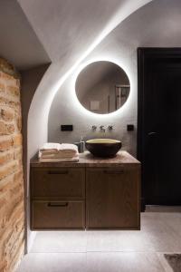 a bathroom with a sink and a mirror at #stayhere - Historic Vilnius Old Town Chic Studio in Vilnius