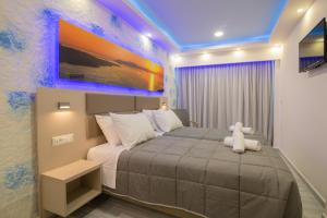 A bed or beds in a room at Sea Diamond Suites