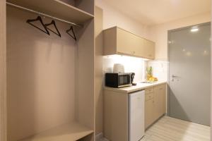 A kitchen or kitchenette at Sea Diamond Suites