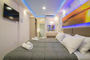 A bed or beds in a room at Sea Diamond Suites