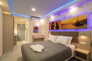 A bed or beds in a room at Sea Diamond Suites