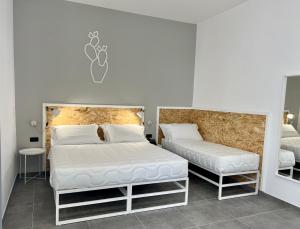 Posteľ alebo postele v izbe v ubytovaní Residence Hotel Moderno