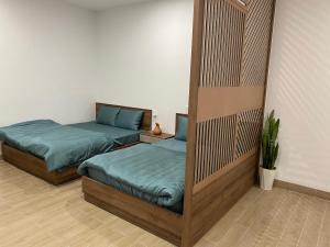 Giường trong phòng chung tại OYO 1161 Puchin Hotel And Apartment