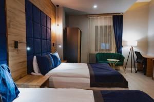 Postel nebo postele na pokoji v ubytování Grand Catalkaya Hotel