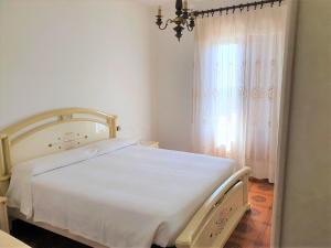 Postel nebo postele na pokoji v ubytování Hotel Madonna di Luciago